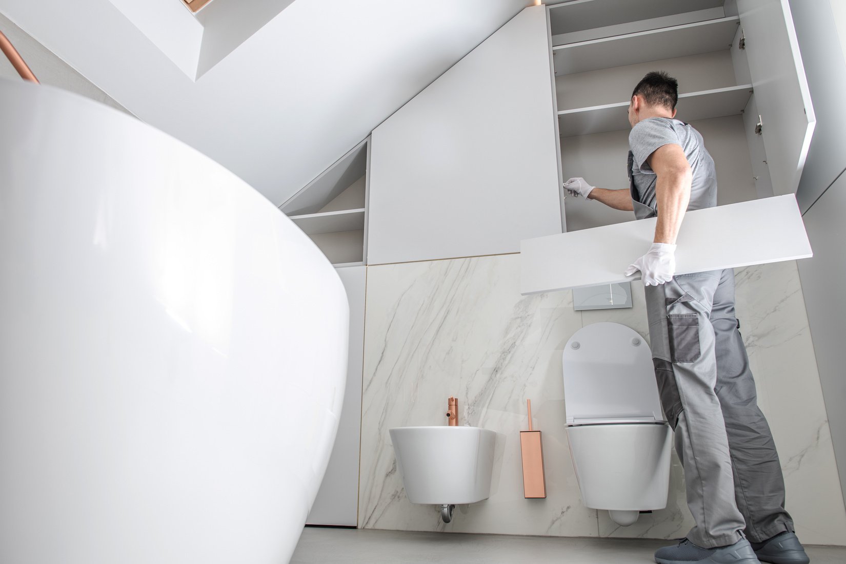 Man Installing Bathroom Interior Finishing